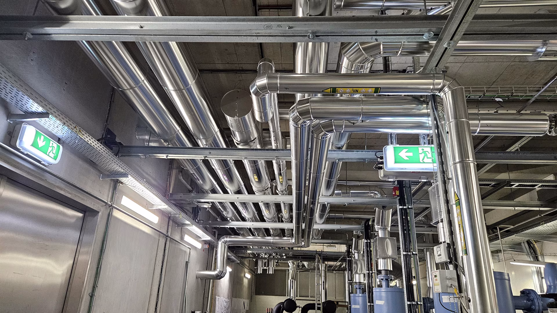 Modern pipework installation with PUR insulation and stainless steel cladding