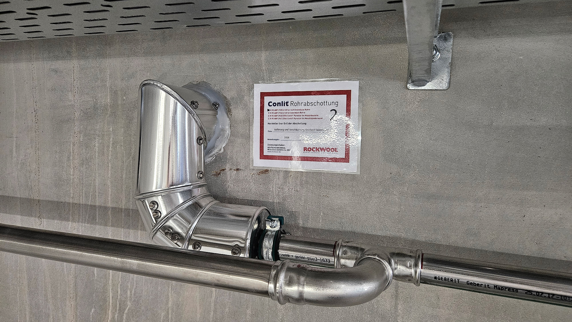 Professionally executed pipe seal in fire wall 02 at Sweet Tec